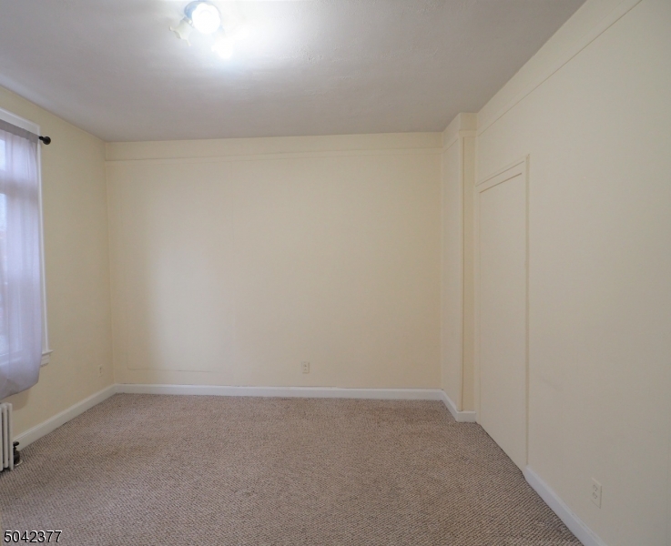 10 Waverly Place, Unit 5 Madison, NJ 07940 - Photo 3 of 4 a room that has a window in it