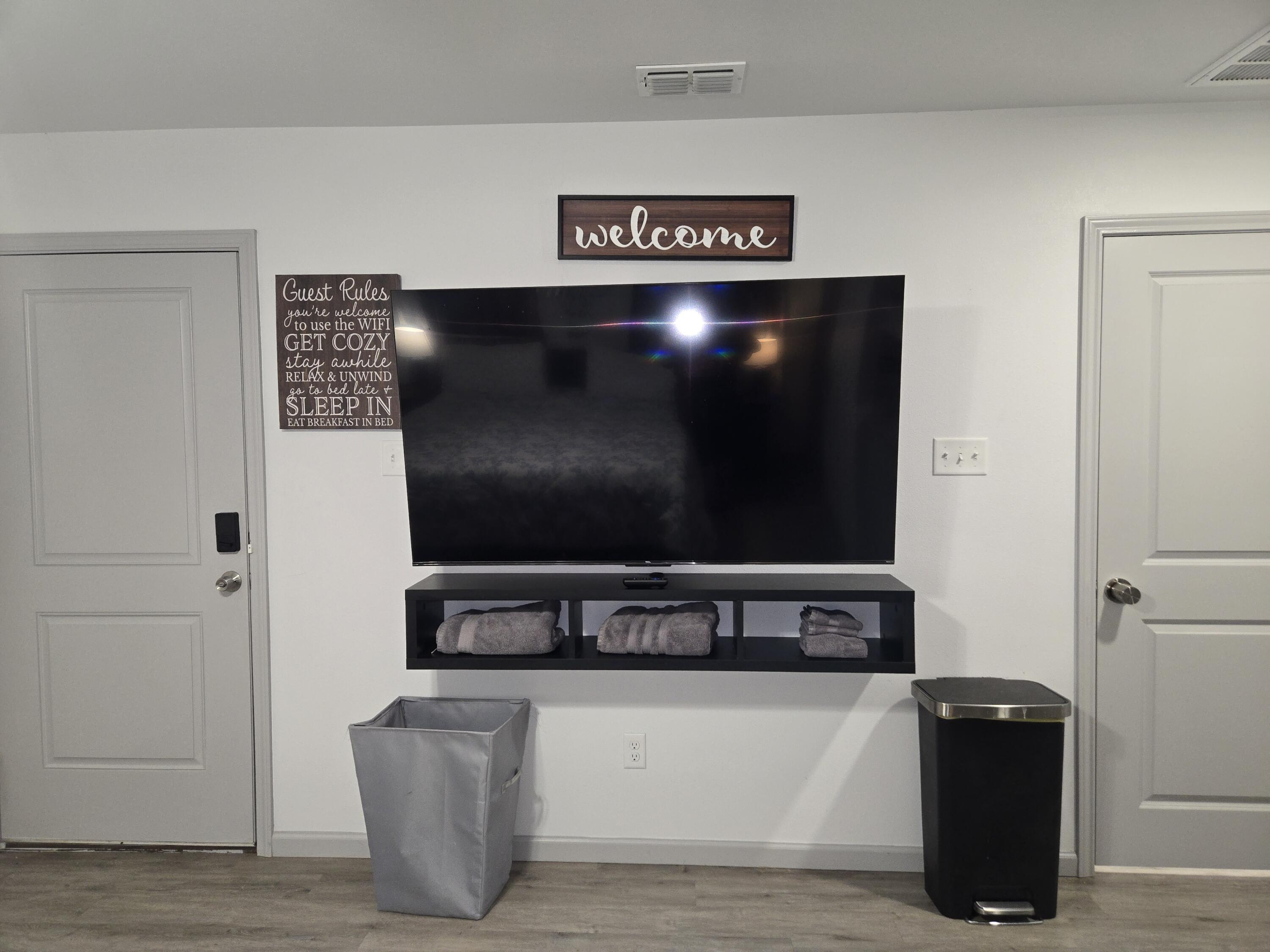 3809 36th Street, Unit A Lubbock, TX 79413 - Photo 4 of 9 a living room with flat screen tv and gym equipment