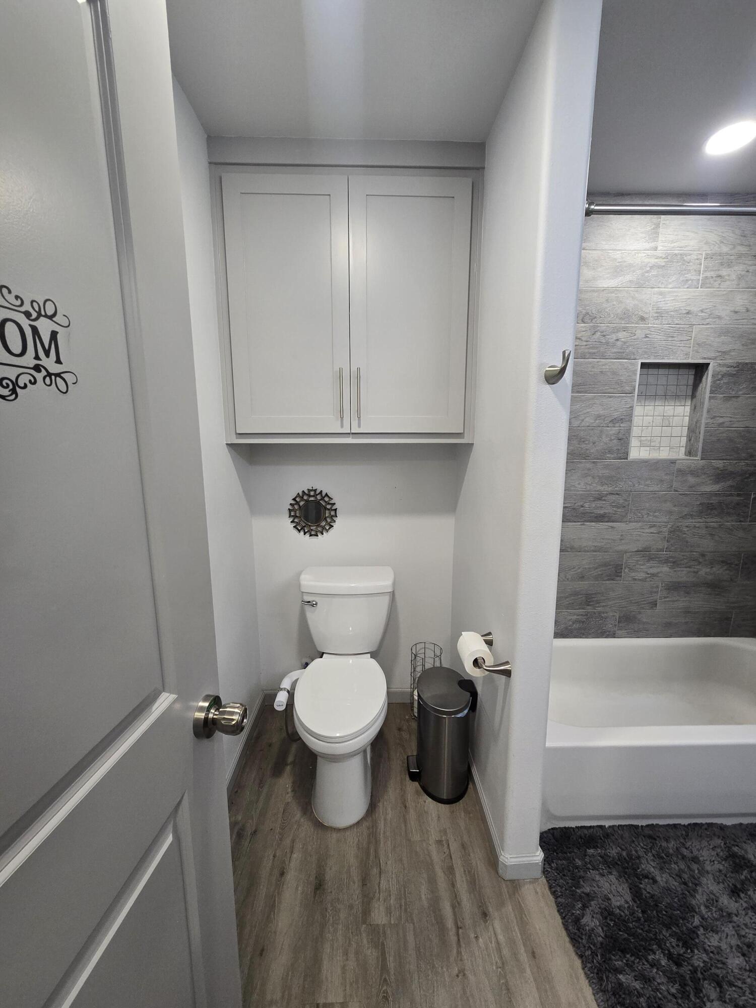 3809 36th Street, Unit A Lubbock, TX 79413 - Photo 9 of 9 a bathroom with a toilet and a shower