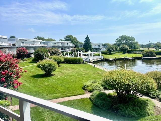 35 Library Avenue, Unit 6J Westhampton Beach, NY 11978 - Photo 1 of 19 View of community with a boat dock, a lawn, and a water view