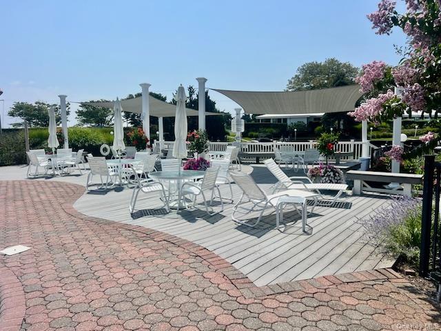 35 Library Avenue, Unit 6J Westhampton Beach, NY 11978 - Photo 19 of 19 View of patio / terrace with a deck