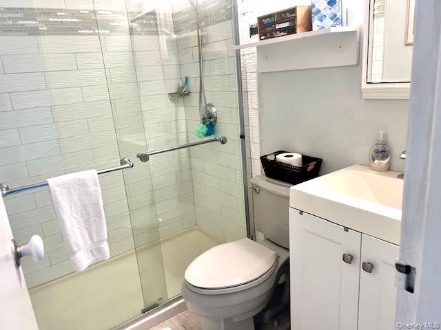 35 Library Avenue, Unit 6J Westhampton Beach, NY 11978 - Photo 8 of 19 Bathroom with vanity and a stall shower
