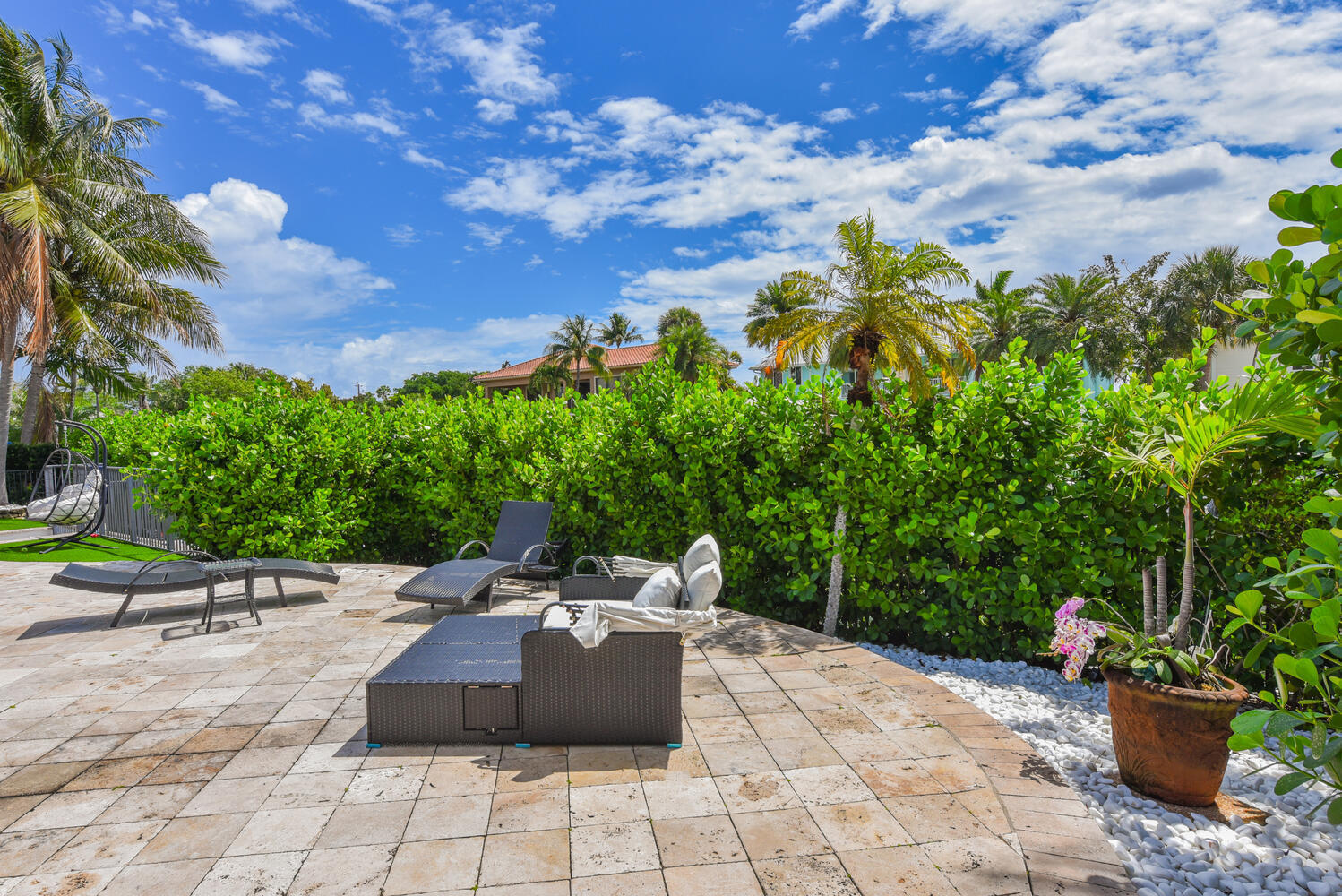 4030 Northeast 25th Avenue Lighthouse Point, FL 33064 - Photo 33 of 50 a view of a backyard with sitting area