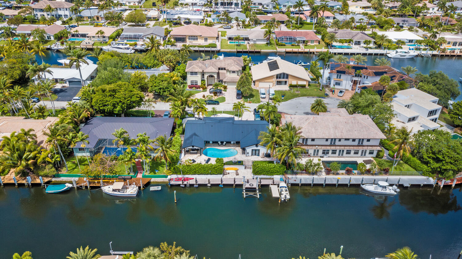 4030 Northeast 25th Avenue Lighthouse Point, FL 33064 - Photo 49 of 50 an aerial view of residential houses with outdoor space and a lake view