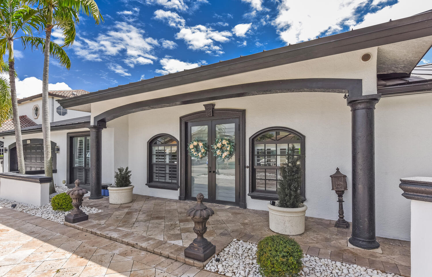 4030 Northeast 25th Avenue Lighthouse Point, FL 33064 - Photo 5 of 50 a front view of a house with outdoor space