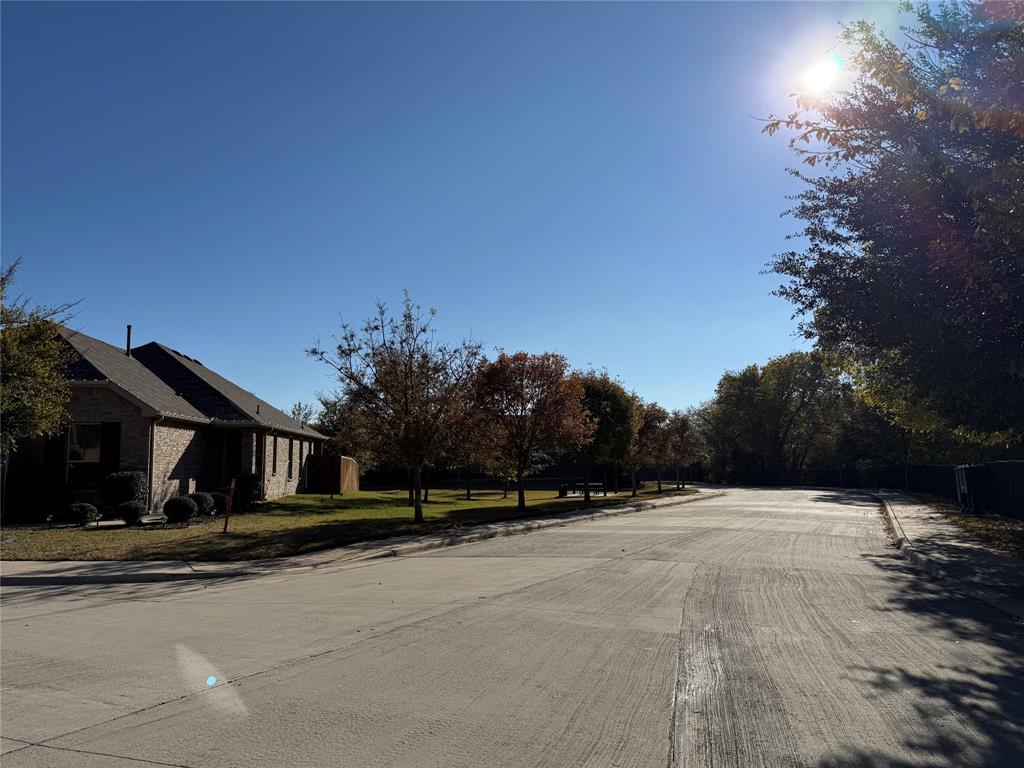 8089 Rabbit Drive Frisco, TX 75034 - Photo 10 of 37 View of concrete street with curbs