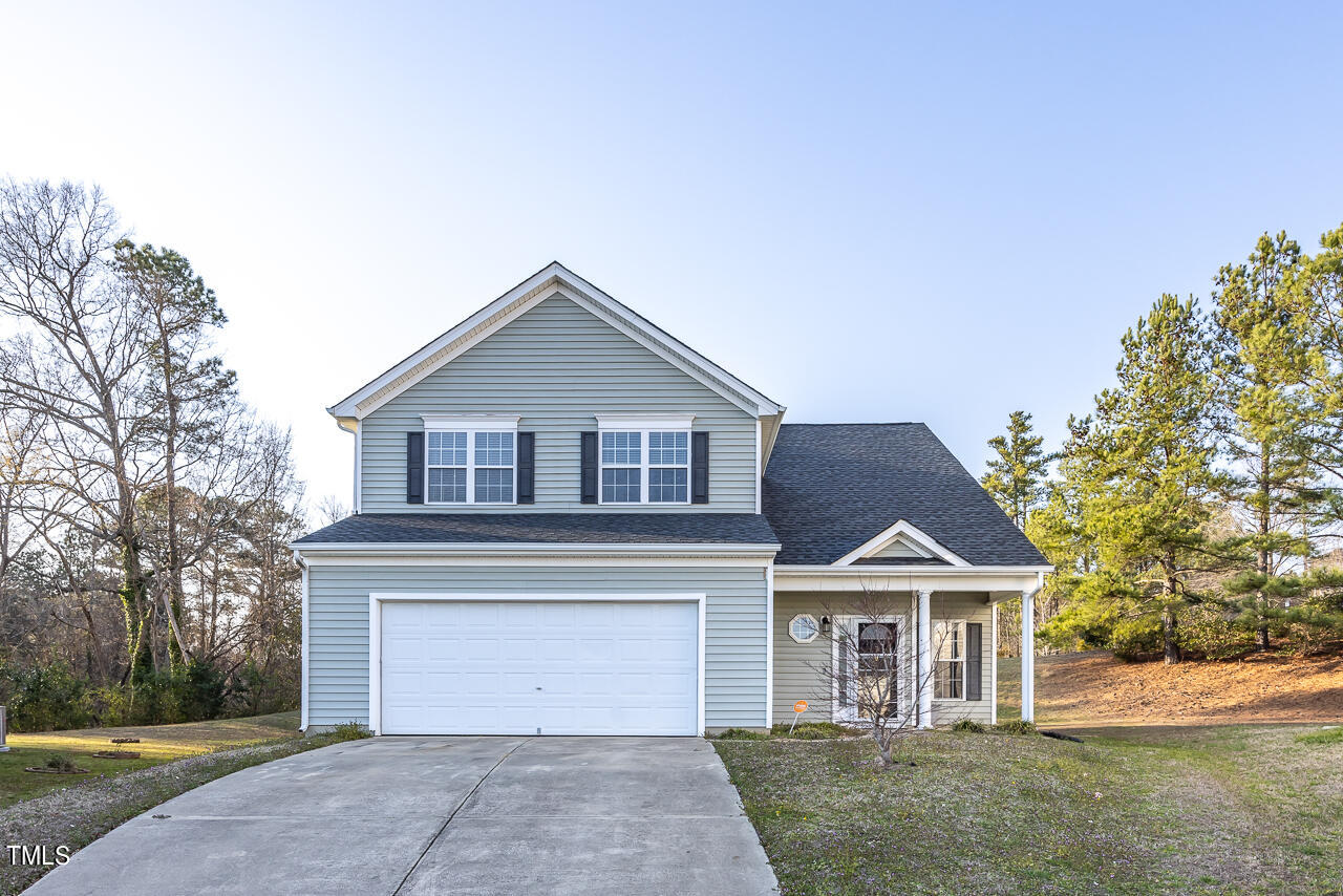 704 Nightshade Way Raleigh, NC 27610 - Photo 1 of 39 a front view of a house with a yard and garage