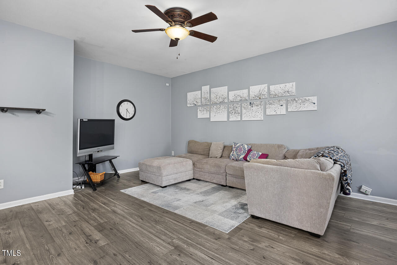 704 Nightshade Way Raleigh, NC 27610 - Photo 12 of 39 a living room with furniture and a flat screen tv