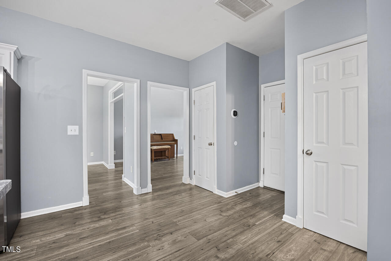 704 Nightshade Way Raleigh, NC 27610 - Photo 21 of 39 a view of a livingroom with wooden floor