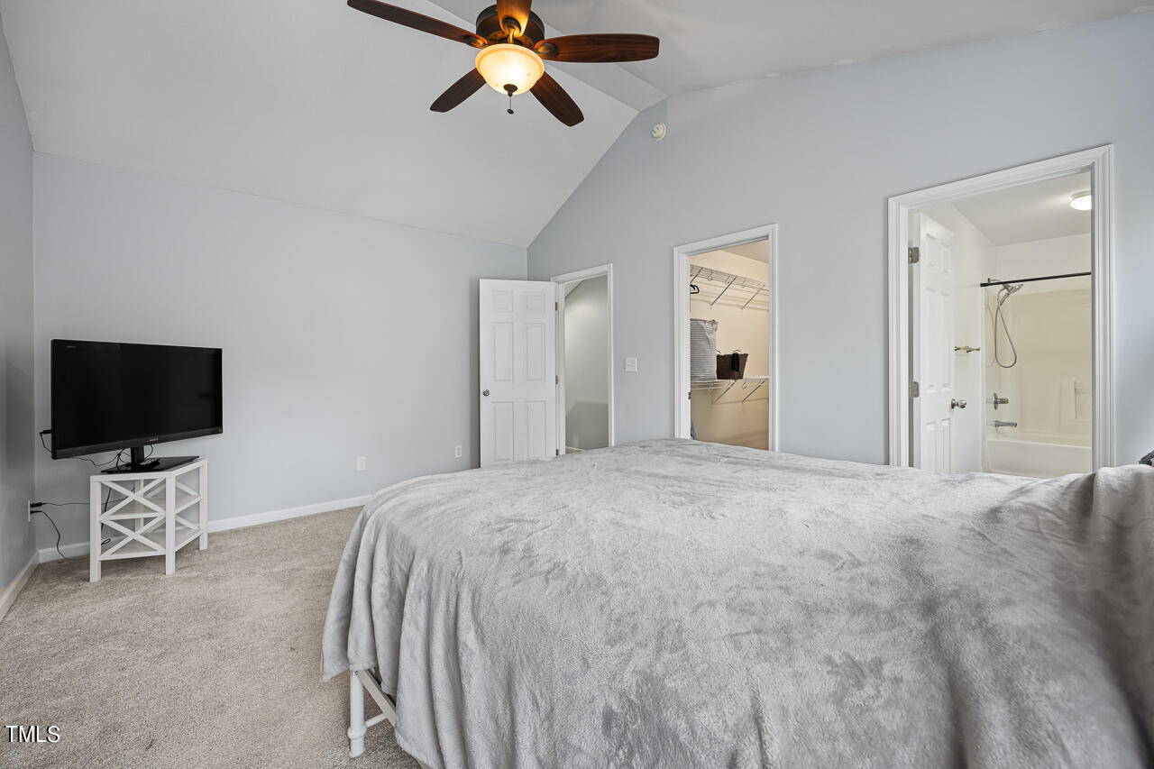 704 Nightshade Way Raleigh, NC 27610 - Photo 23 of 39 a bedroom with a bed and a flat screen tv