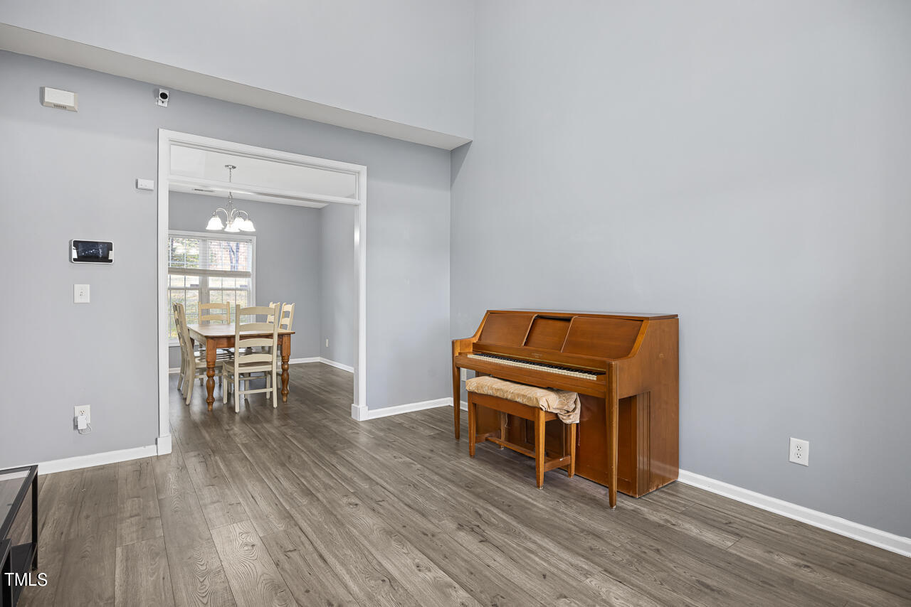 704 Nightshade Way Raleigh, NC 27610 - Photo 5 of 39 a room with furniture and wooden floor