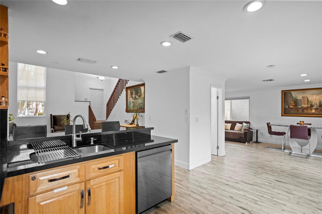 9837 Northwest 2nd Court Plantation, FL 33324 - Photo 13 of 69 a kitchen with granite countertop a sink and cabinets