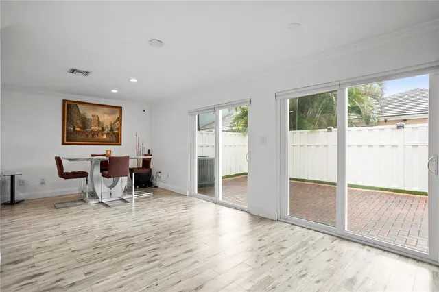 a view of kitchen with granite countertop window