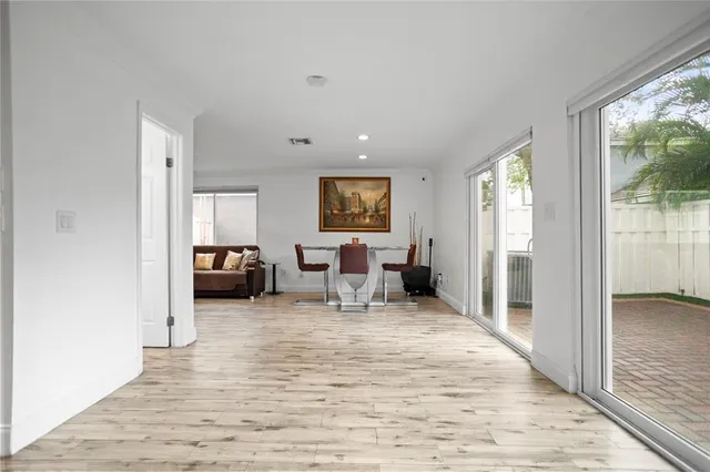a view of a kitchen with a sink and a refrigerator