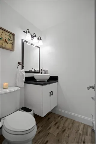 a large kitchen with stainless steel appliances kitchen island granite countertop a refrigerator and a stove top oven