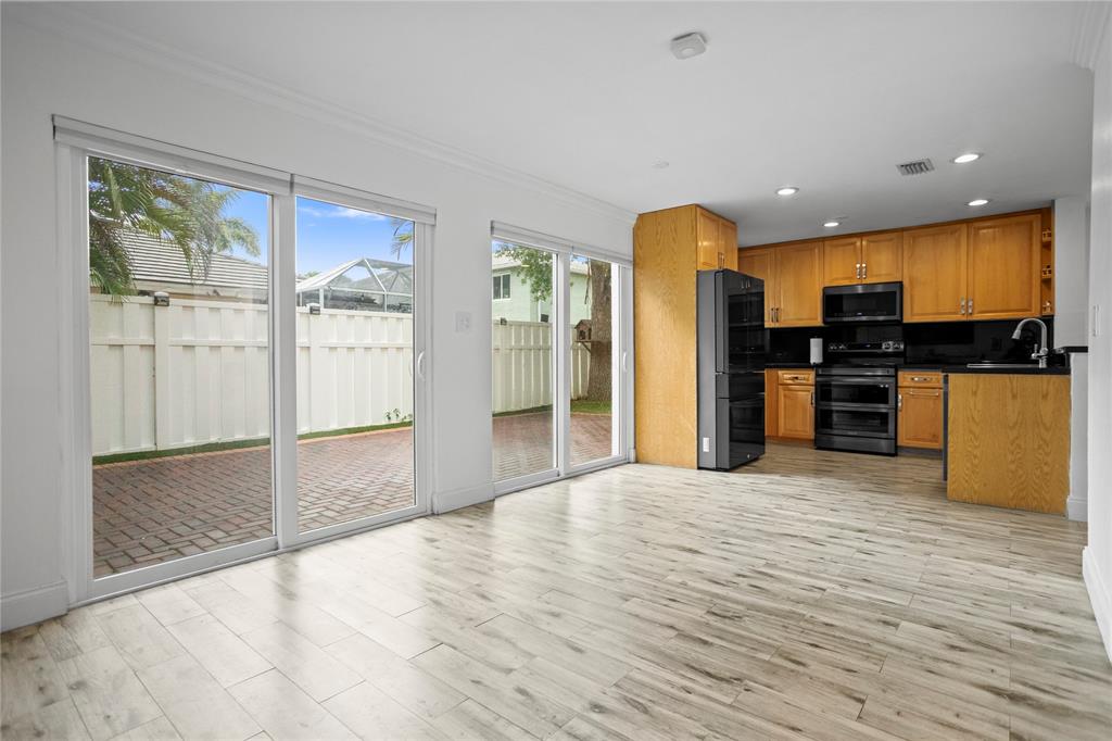 9837 Northwest 2nd Court Plantation, FL 33324 - Photo 19 of 69 a view of a kitchen with a sink and a refrigerator