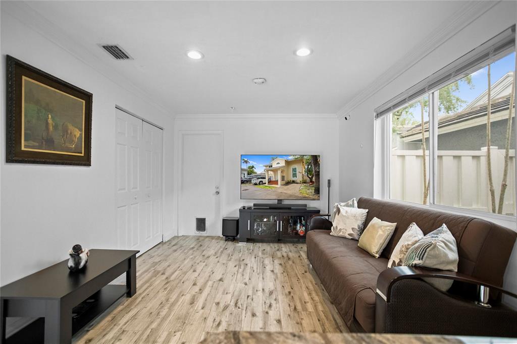 9837 Northwest 2nd Court Plantation, FL 33324 - Photo 21 of 69 a living room with furniture and a flat screen tv