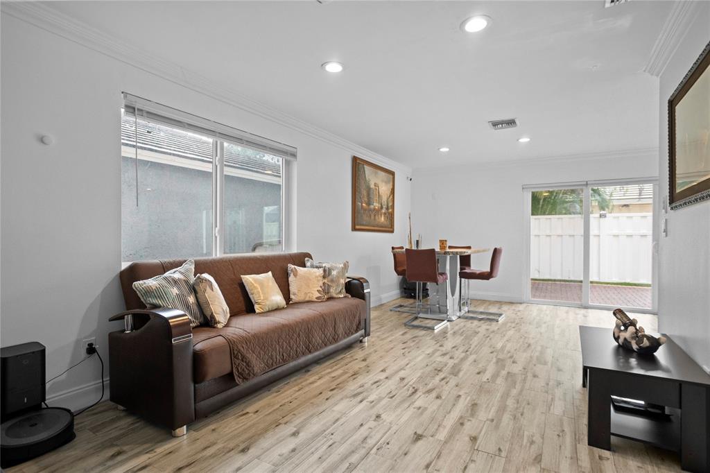 9837 Northwest 2nd Court Plantation, FL 33324 - Photo 25 of 69 a living room with furniture and a wooden floor