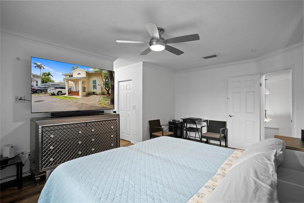 9837 Northwest 2nd Court Plantation, FL 33324 - Photo 39 of 69 a bed room with a bed and a television