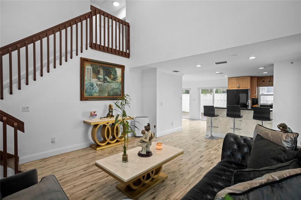 9837 Northwest 2nd Court Plantation, FL 33324 - Photo 4 of 69 a living room with furniture and wooden floor