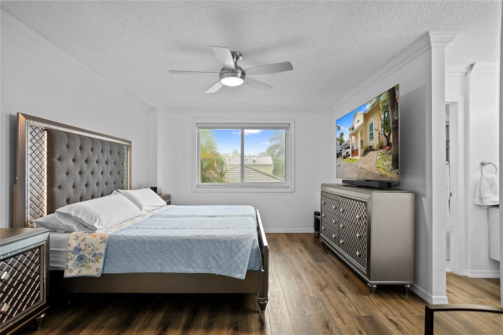 9837 Northwest 2nd Court Plantation, FL 33324 - Photo 42 of 69 a bedroom with a bed and a window