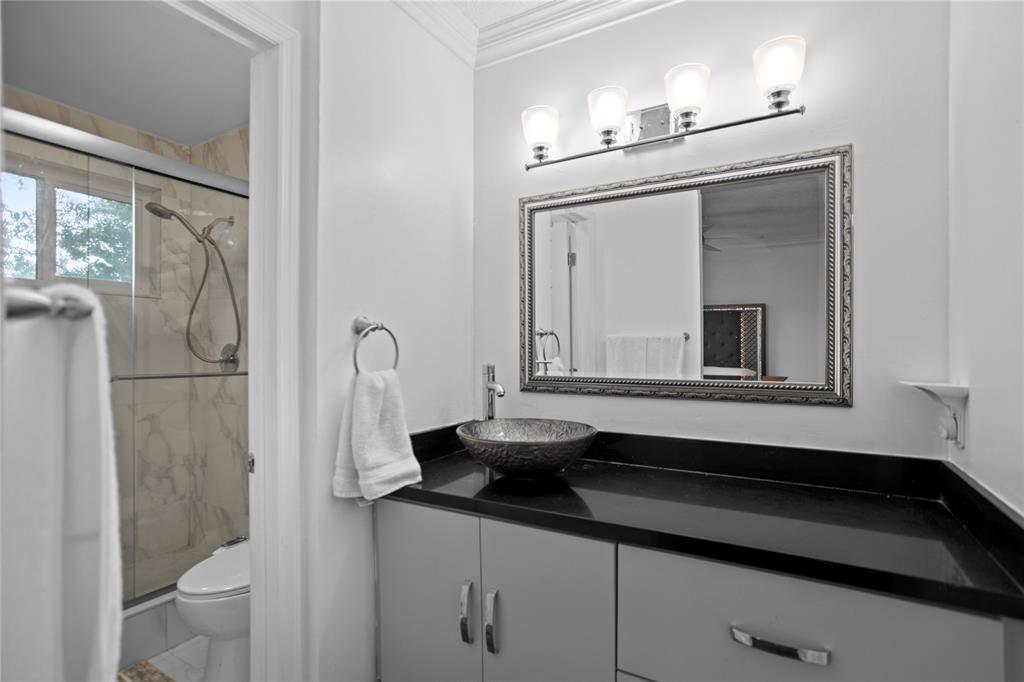 9837 Northwest 2nd Court Plantation, FL 33324 - Photo 43 of 69 a bathroom with a sink a toilet and a mirror