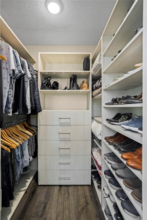 9837 Northwest 2nd Court Plantation, FL 33324 - Photo 44 of 69 a view of walk in closet with clothes and shoes