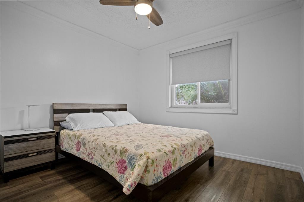 9837 Northwest 2nd Court Plantation, FL 33324 - Photo 48 of 69 a bedroom with a bed and a window