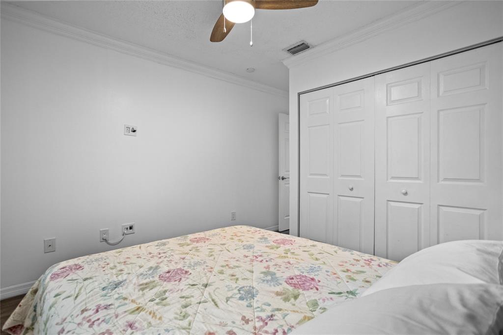 9837 Northwest 2nd Court Plantation, FL 33324 - Photo 50 of 69 a bedroom with a bed and a dresser