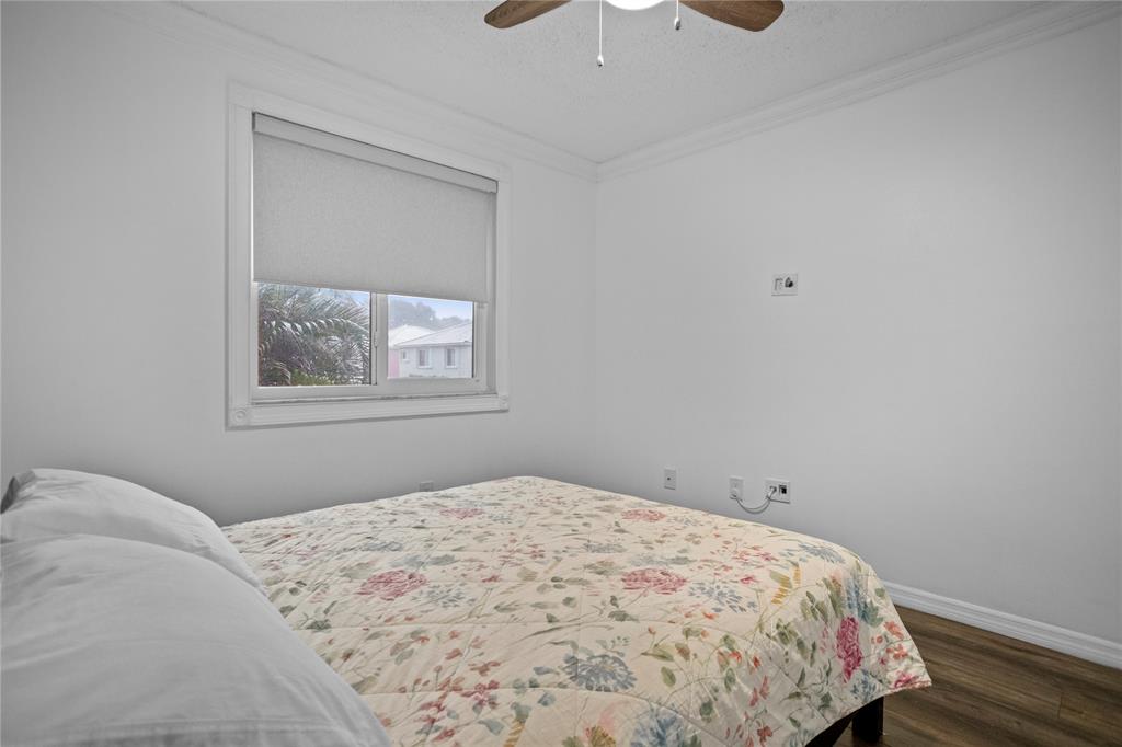 9837 Northwest 2nd Court Plantation, FL 33324 - Photo 51 of 69 a bedroom with a bed and a window
