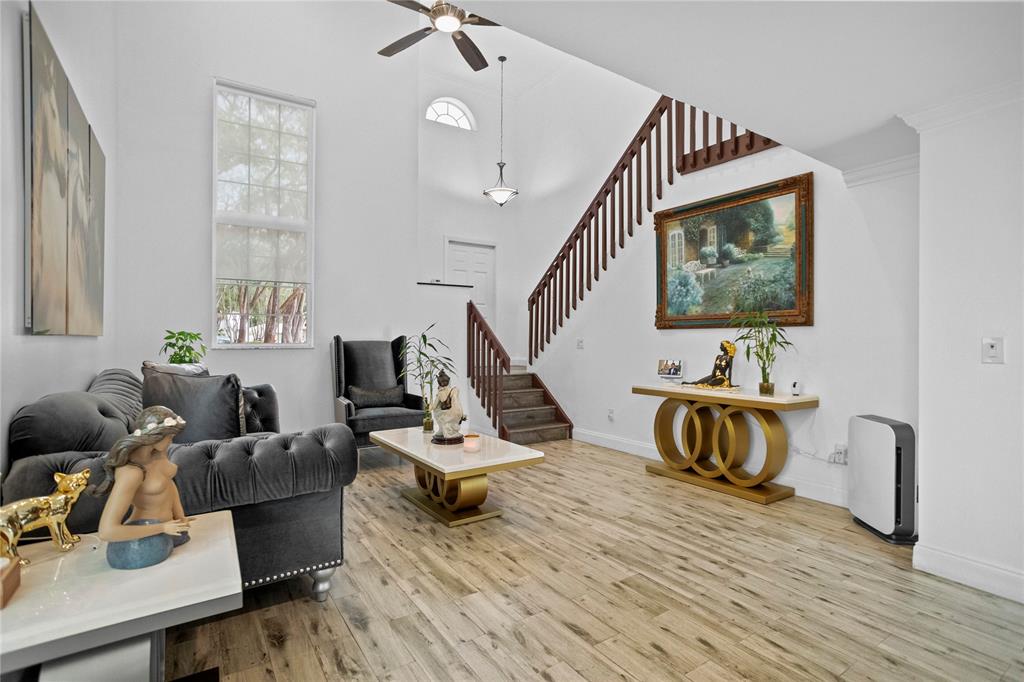 9837 Northwest 2nd Court Plantation, FL 33324 - Photo 7 of 69 a living room with furniture and a wooden floor
