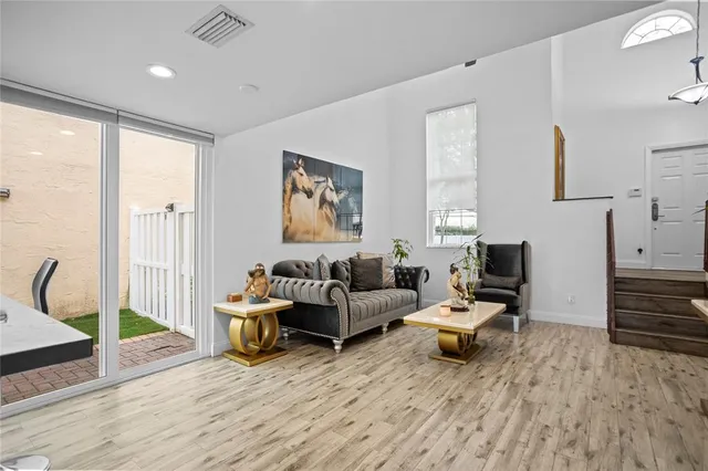 a kitchen with a sink appliances and cabinets