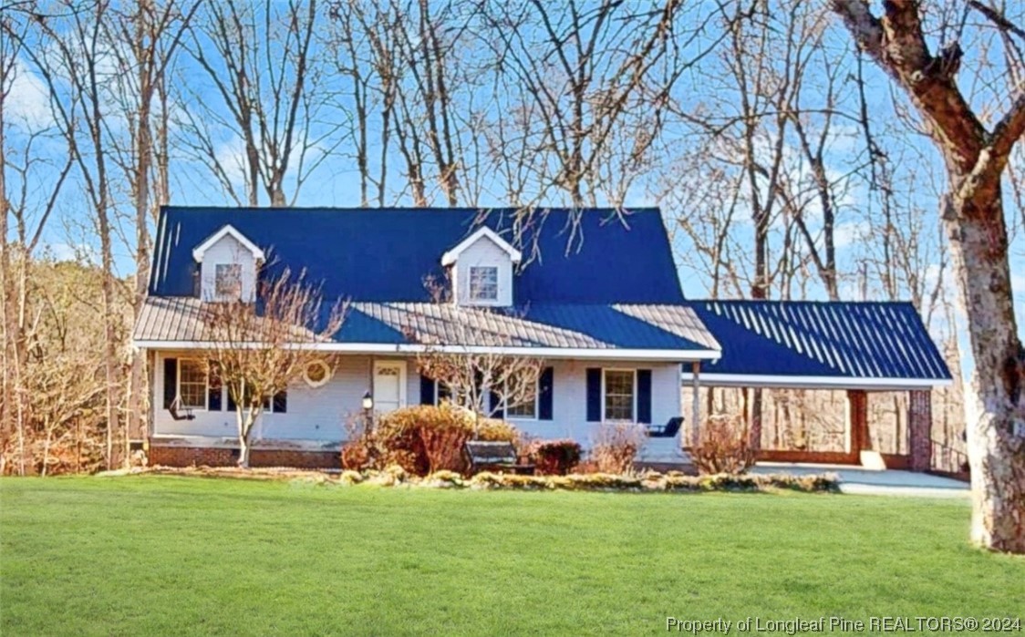 1132 North Moore Road Robbins, NC 27325 - Photo 2 of 50 front view of a house with a yard