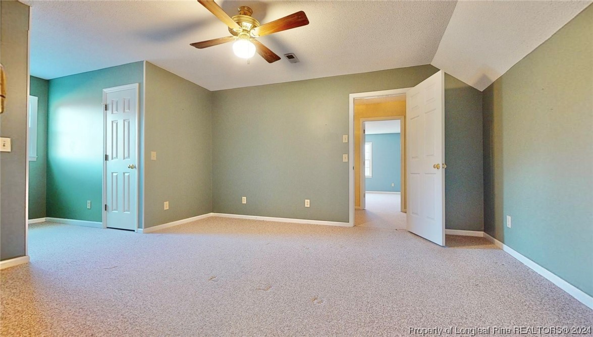1132 North Moore Road Robbins, NC 27325 - Photo 28 of 50 an empty room with closet and a chandelier fan