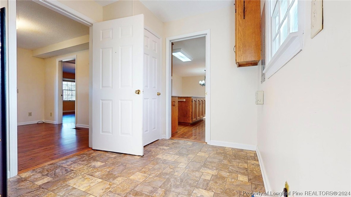 1132 North Moore Road Robbins, NC 27325 - Photo 6 of 50 a view of a hallway with wooden floor and entryway