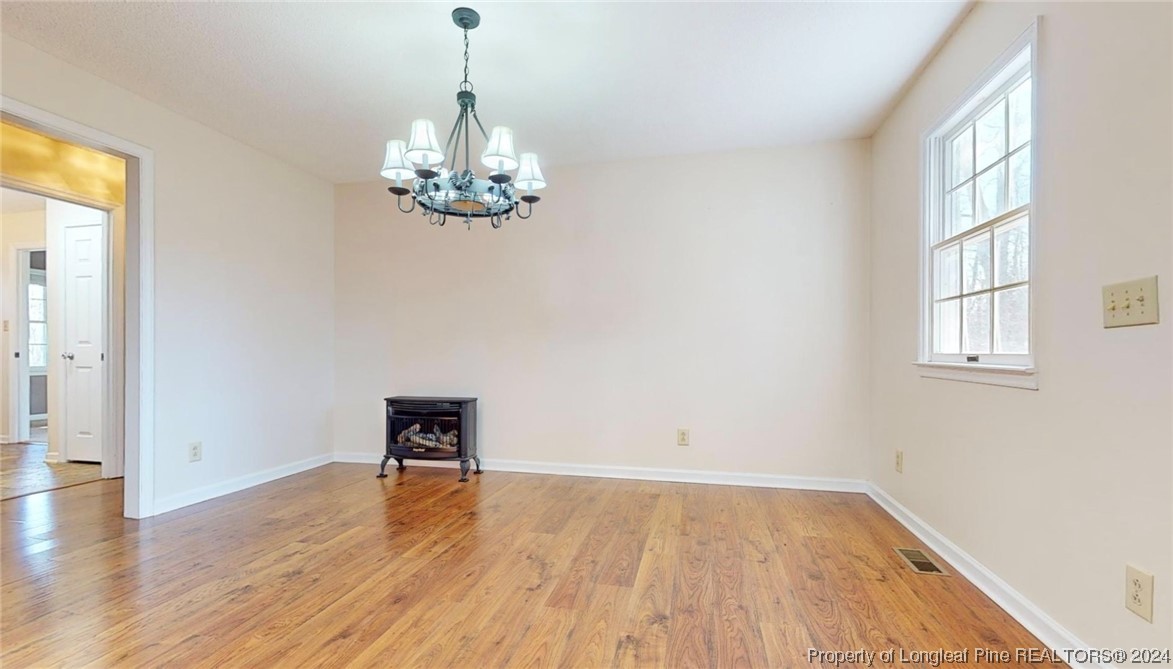 1132 North Moore Road Robbins, NC 27325 - Photo 8 of 50 wooden floor in an empty room with a window