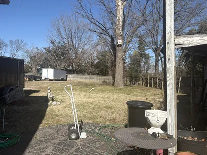 a view of a yard with patio