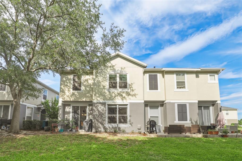 6458 South Goldenrod Road, Unit 29B Orlando, FL 32822 - Photo 31 of 40 front view of a house with a yard
