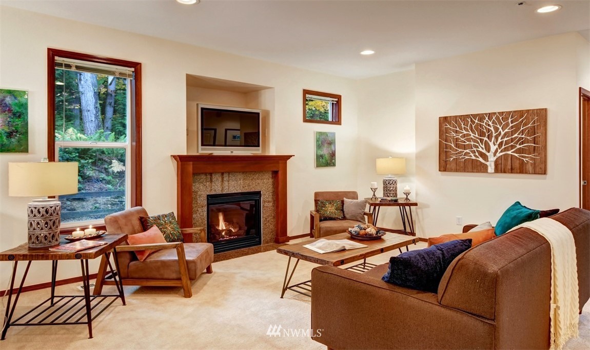 21622 11th Court Southeast Bothell, WA 98021 - Photo 2 of 19 a living room with furniture and a fireplace