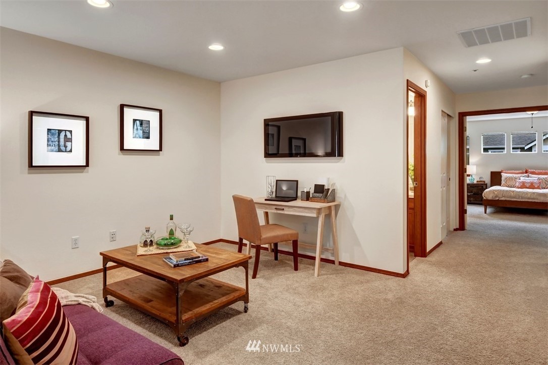 21622 11th Court Southeast Bothell, WA 98021 - Photo 11 of 19 a living room with furniture and a flat screen tv