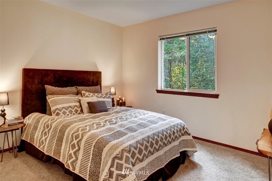 21622 11th Court Southeast Bothell, WA 98021 - Photo 16 of 19 a bedroom with a bed and window