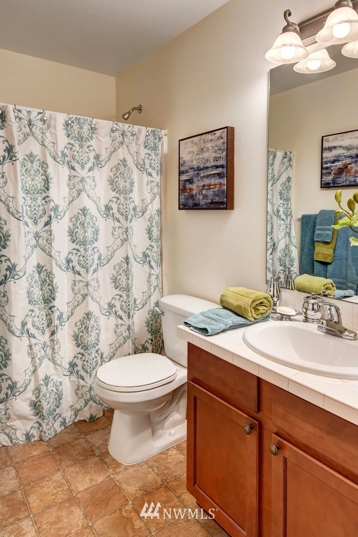 21622 11th Court Southeast Bothell, WA 98021 - Photo 17 of 19 a bathroom with a sink toilet and mirror