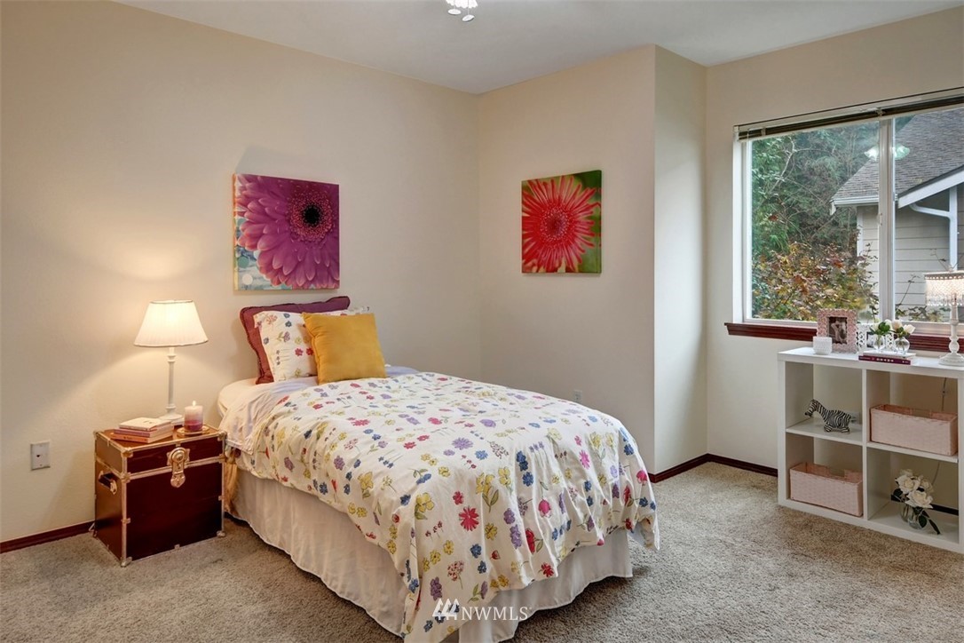 21622 11th Court Southeast Bothell, WA 98021 - Photo 18 of 19 a bedroom with a bed and a cabinets