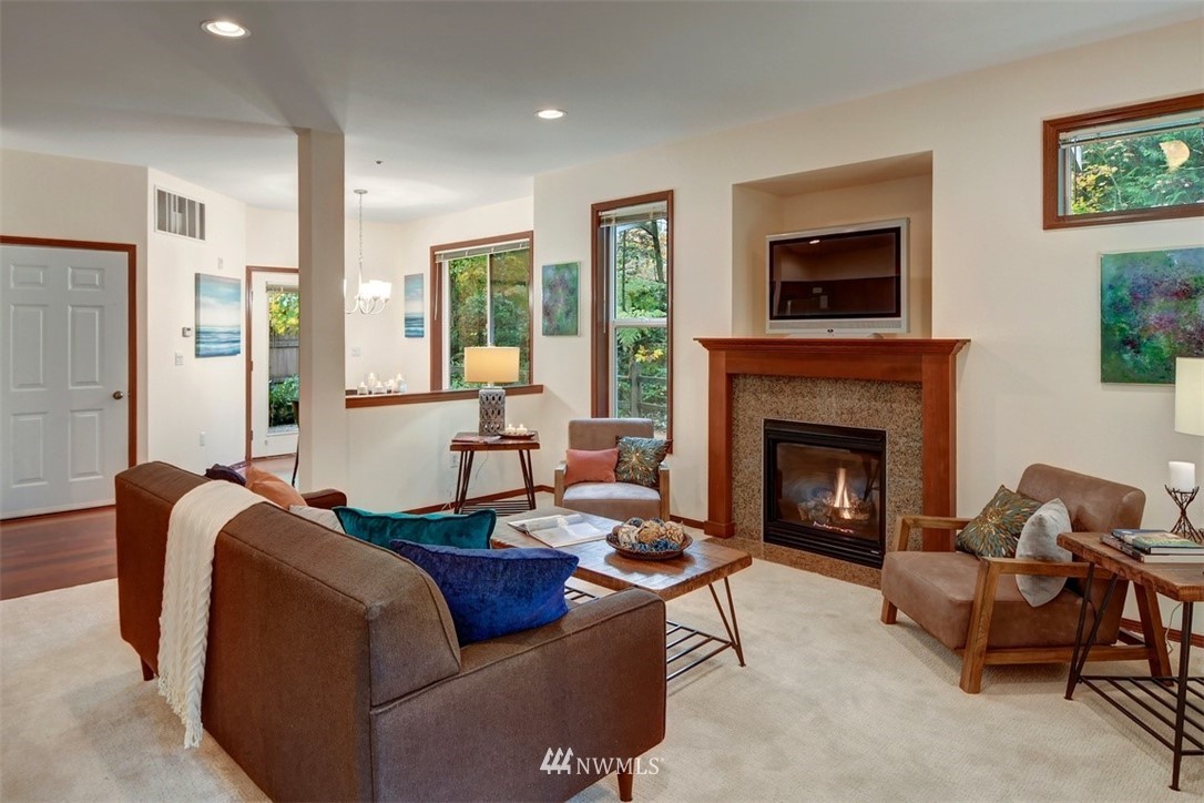21622 11th Court Southeast Bothell, WA 98021 - Photo 3 of 19 a living room with furniture a flat screen tv and a fireplace