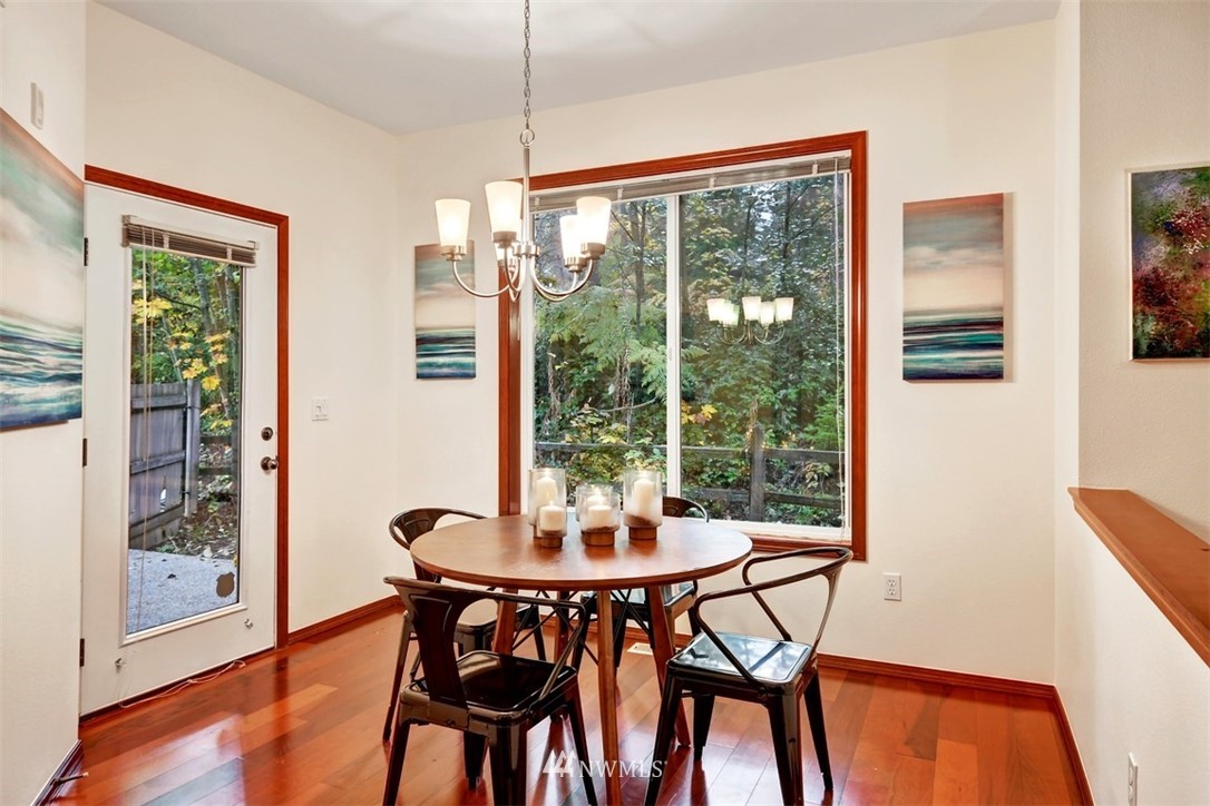 21622 11th Court Southeast Bothell, WA 98021 - Photo 5 of 19 a view of a dining room with furniture window and wooden floor