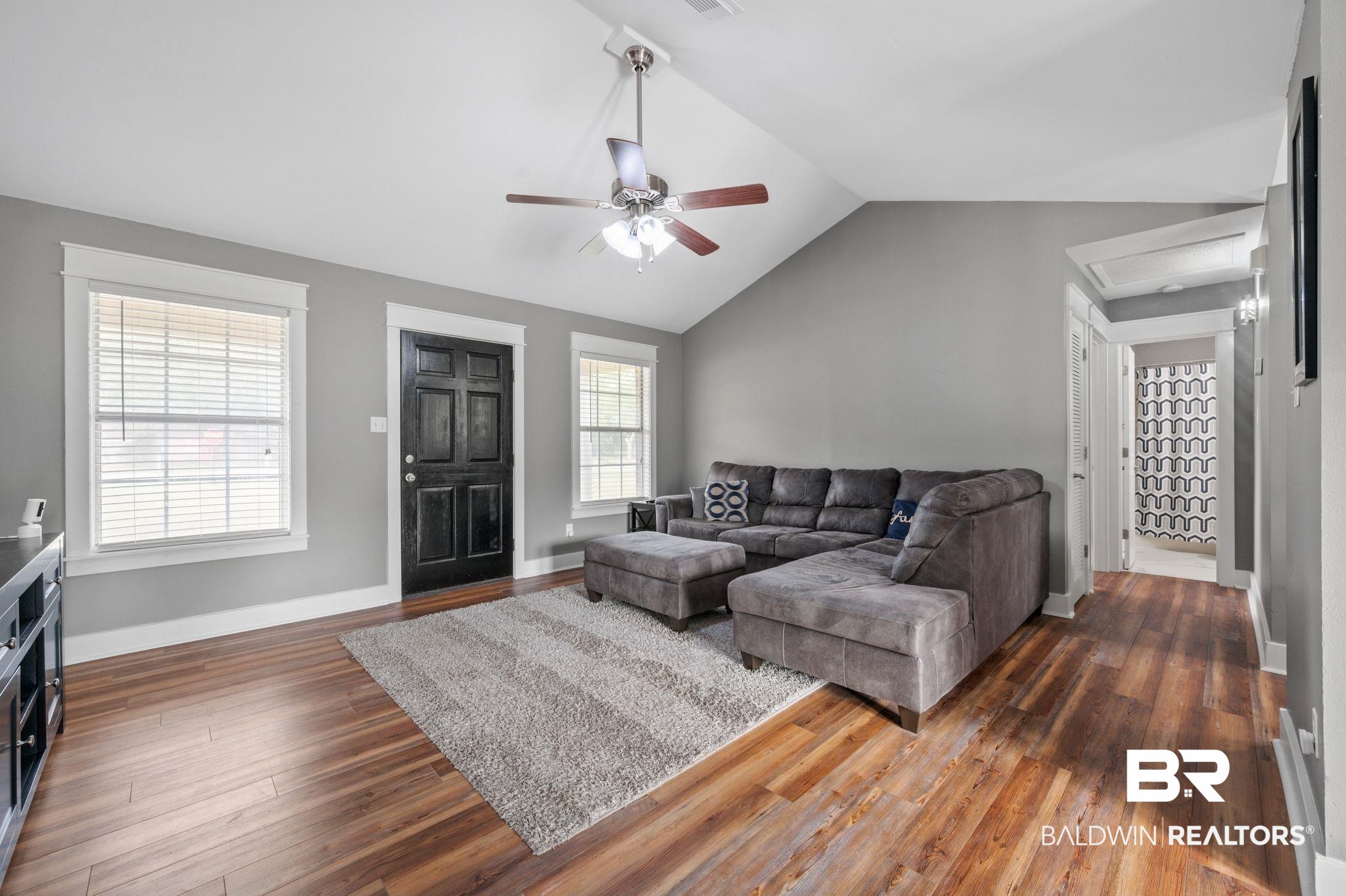 1107 North Oak Street Loxley, AL 36551 - Photo 2 of 40 Living room featuring dark wood-type flooring, ceiling fan, and lofted ceiling