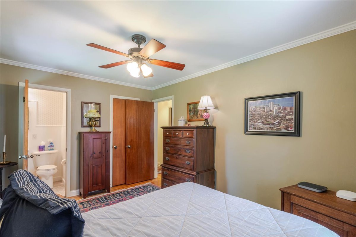 302 Radliff Road Bloomington, IL 61701 - Photo 15 of 35 a bedroom with a bed and a chandelier