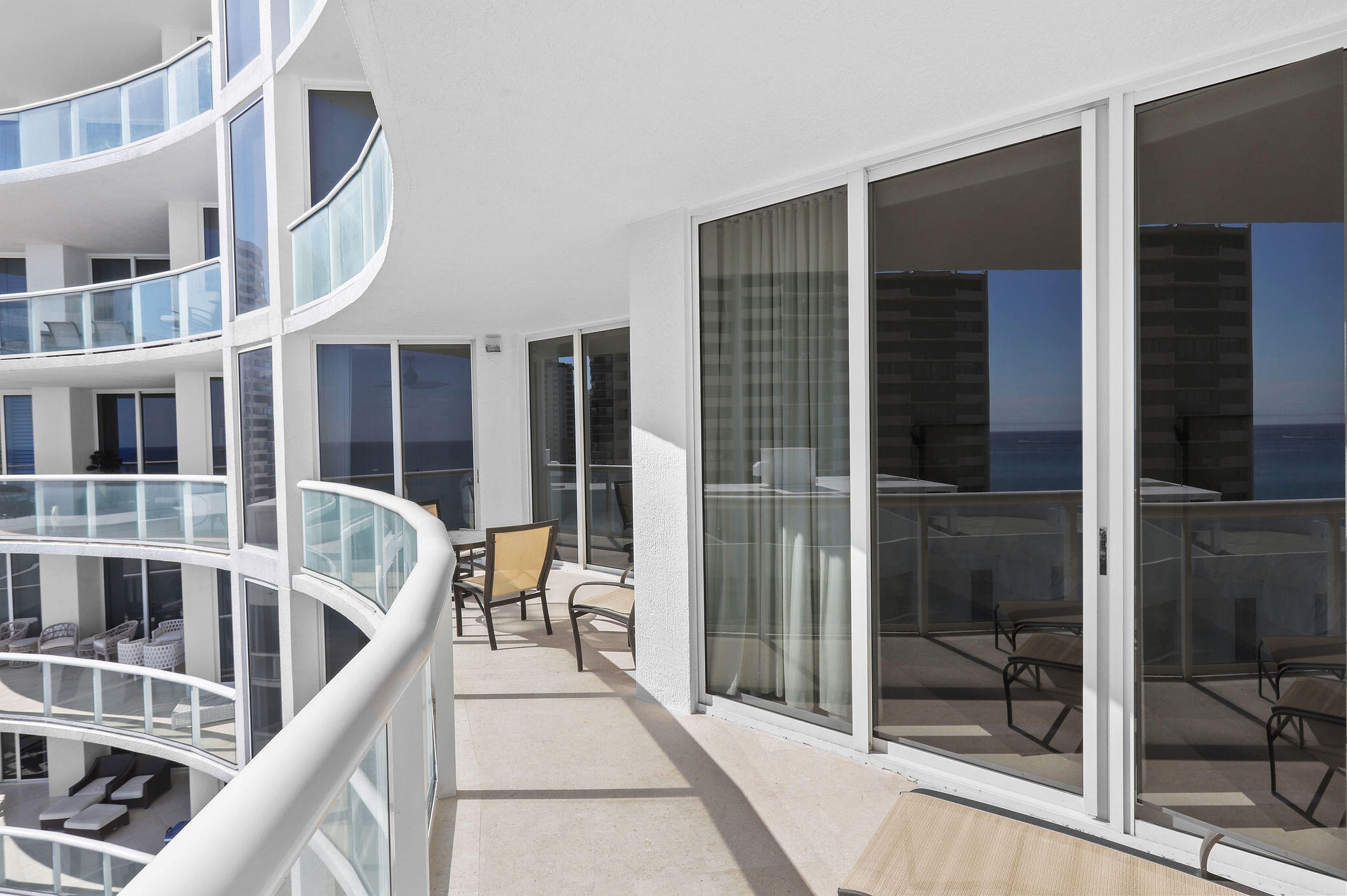 4600 North Ocean Drive, Unit 902 Singer Island, FL 33404 - Photo 12 of 79 a balcony view with a large window and glass door