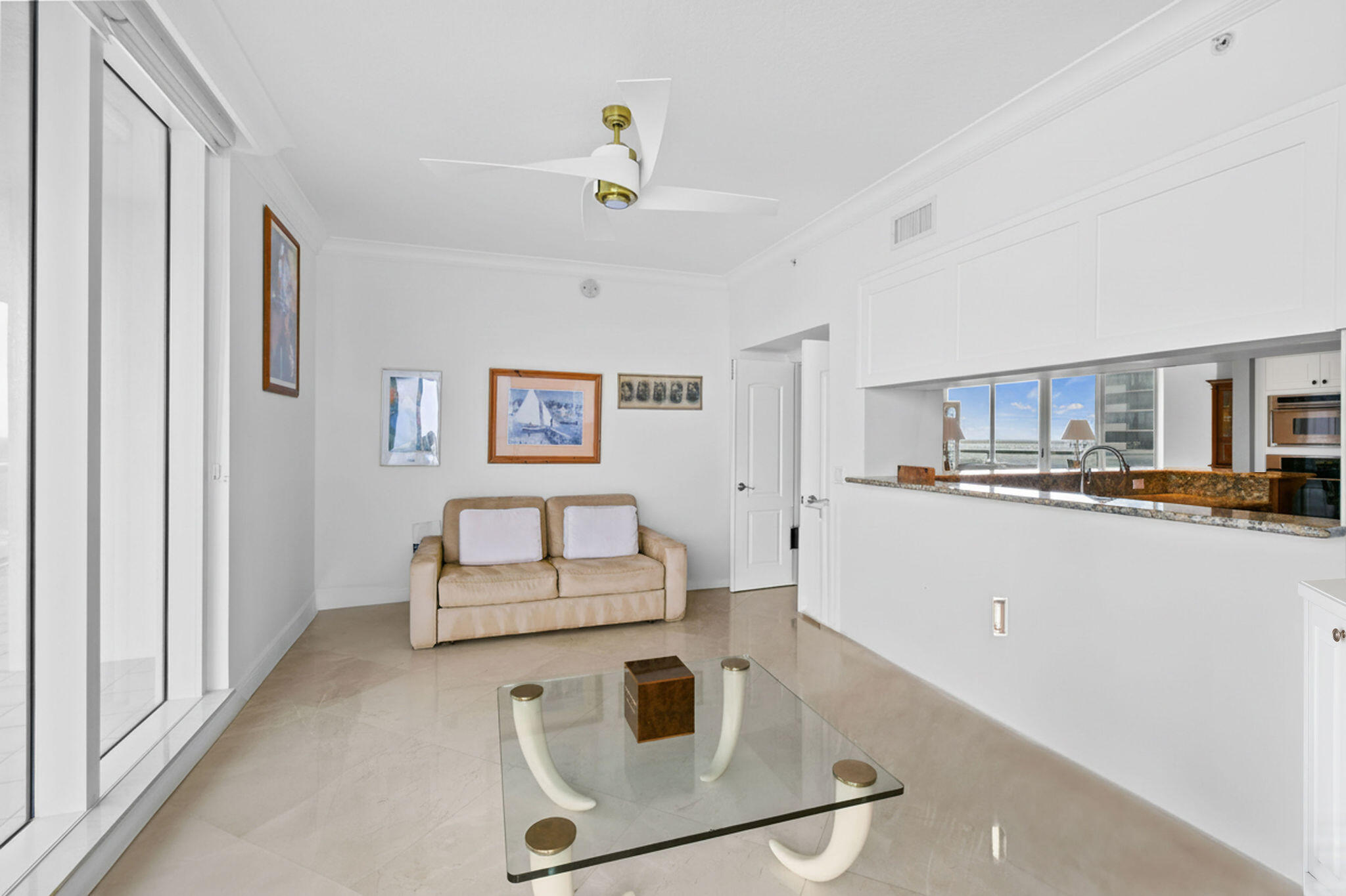 4600 North Ocean Drive, Unit 902 Singer Island, FL 33404 - Photo 25 of 79 a kitchen with kitchen island stainless steel appliances a stove refrigerator sink and cabinets