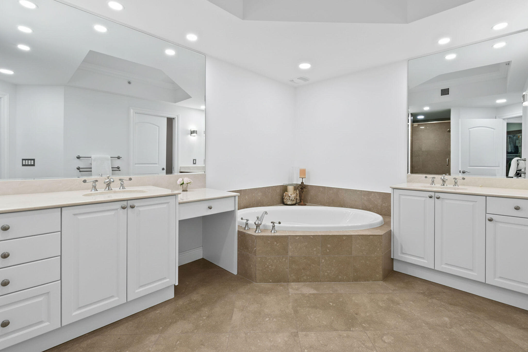 4600 North Ocean Drive, Unit 902 Singer Island, FL 33404 - Photo 39 of 79 a spacious bathroom with a double vanity sink mirror and bathtub